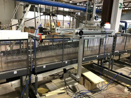 How vegetation in flows modifies the turbulent mixing and spreading of jets