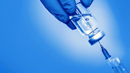 Impact of the aqueous corrosion induced alteration layer on mechanical properties of pharmaceutical glasses