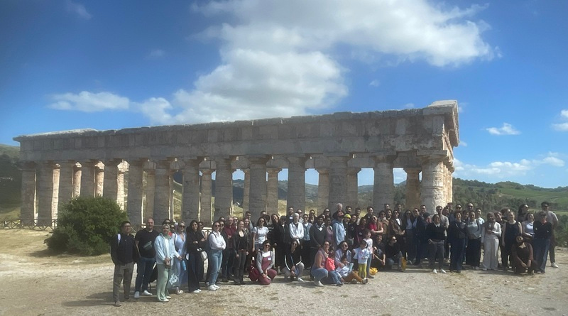 Group photo in front of ancient Greek ruins.