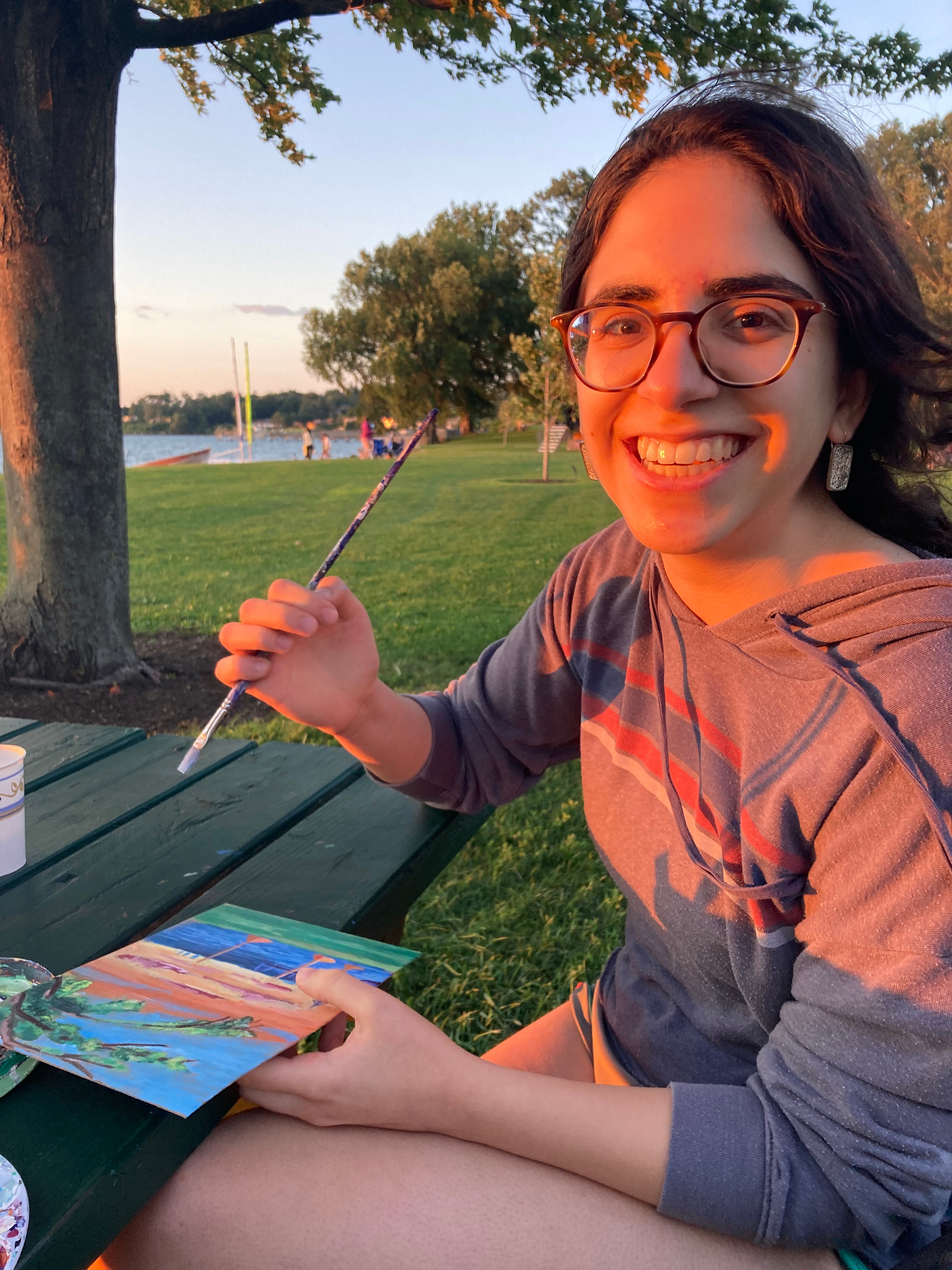 Me painting at a park in my hometown last summer! Art was often my way of de-stressing as I researched from home. 