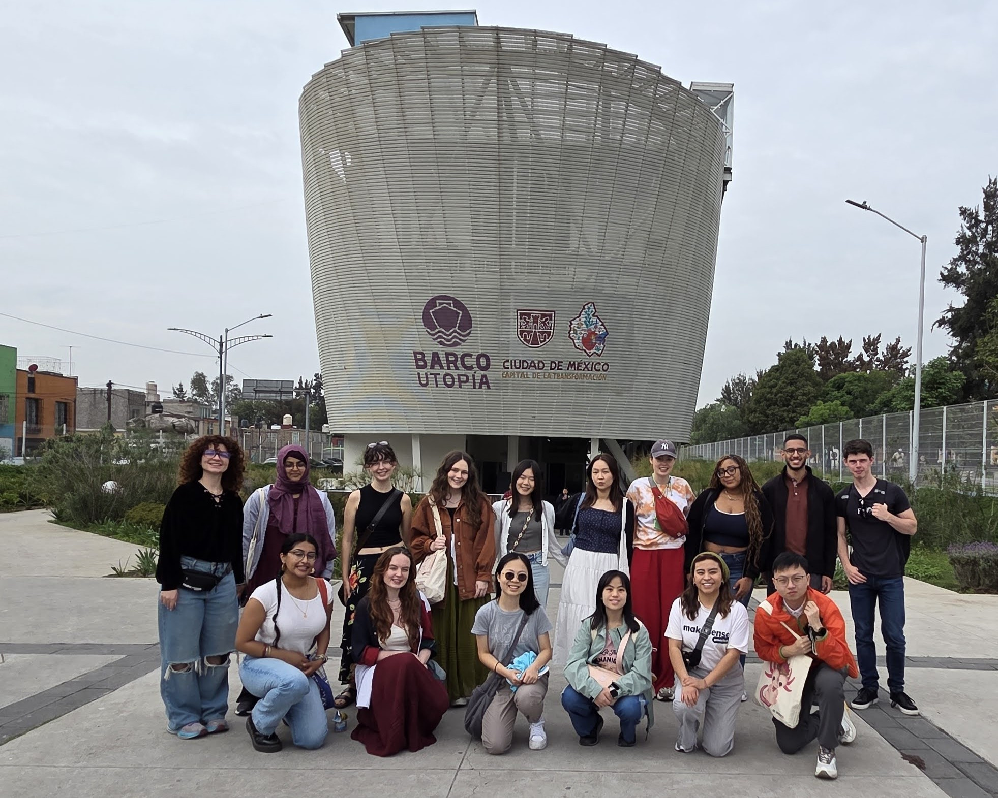 Image of the Laidlaw Scholars in front of a building that looks like a boat.