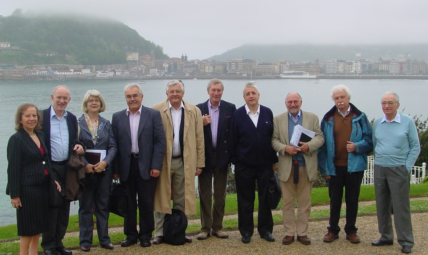 Group photo, standing by a body of water.