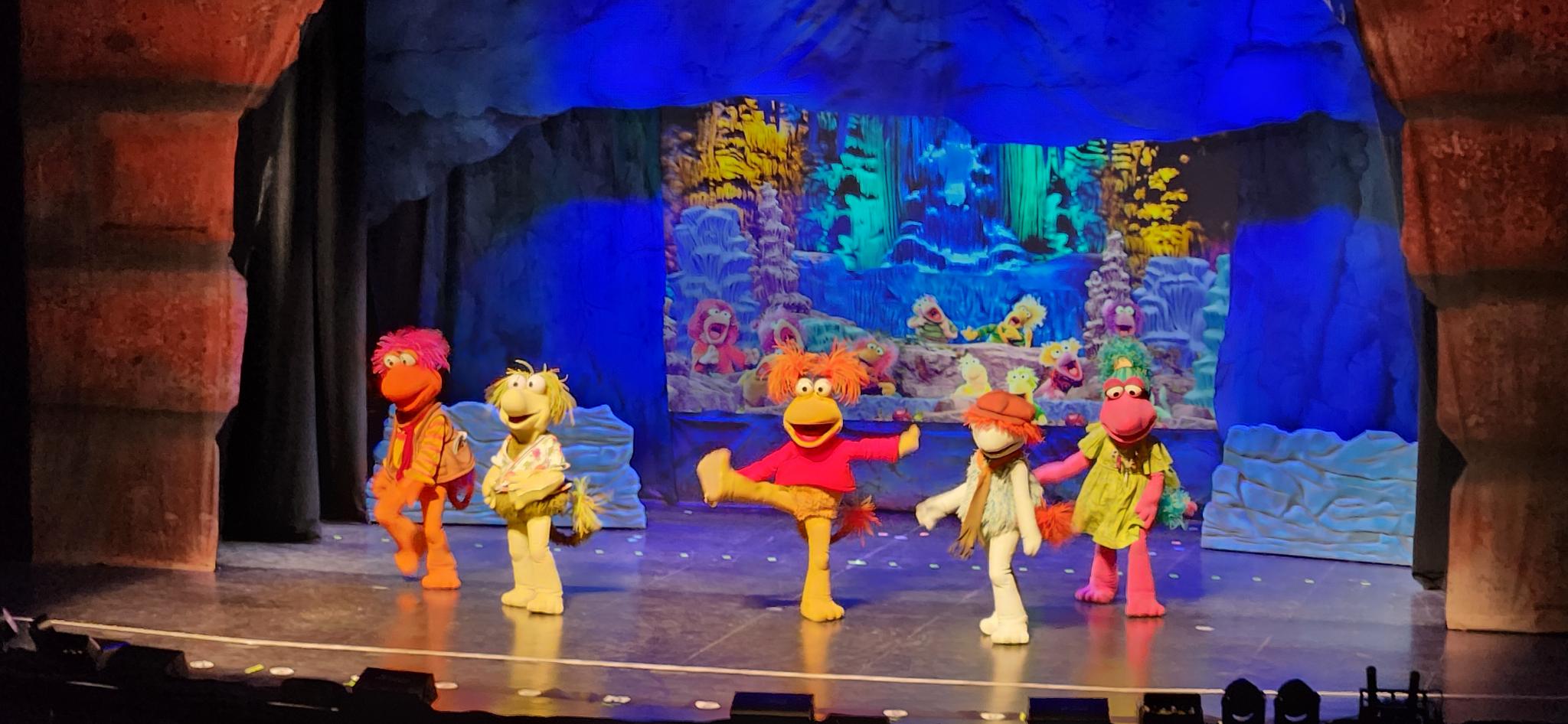 The Fraggles dancing on stage