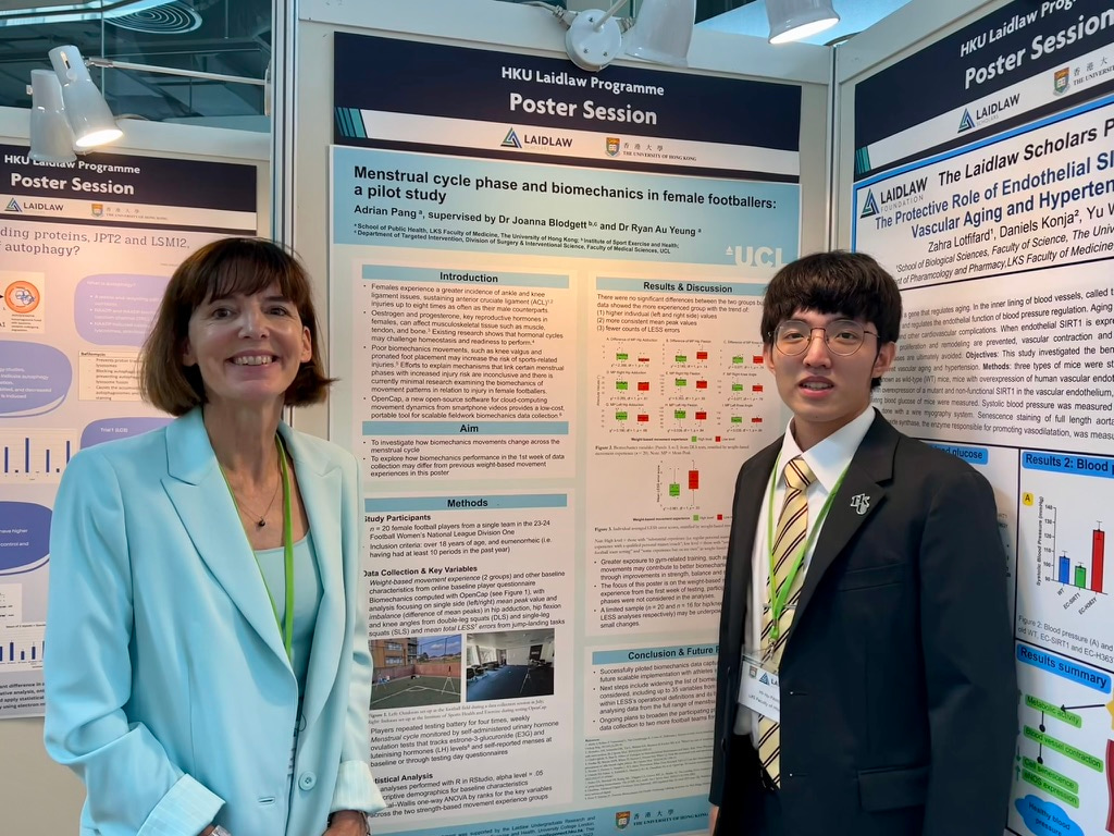 HKU Laidlaw Scholar Adrian Pang taking a photo with Laidlaw Foundation Chief Executive Susanna Kempe in front of a research poster