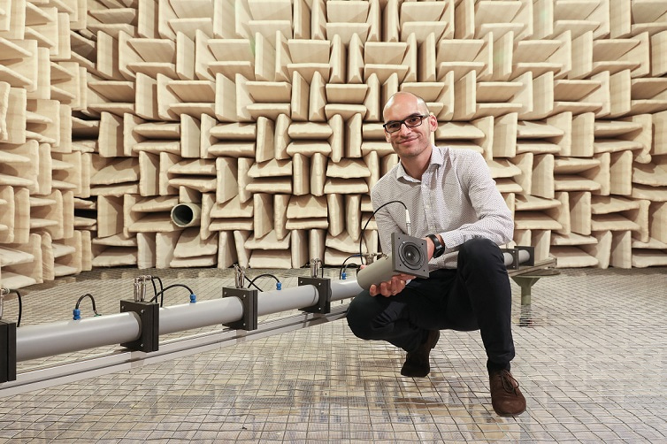 Etienne Rivet, the first author of the paper, in front of the prototype in our acoustic anechoic chamber at EPFL.