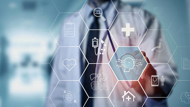 A doctor touching a screen with icons