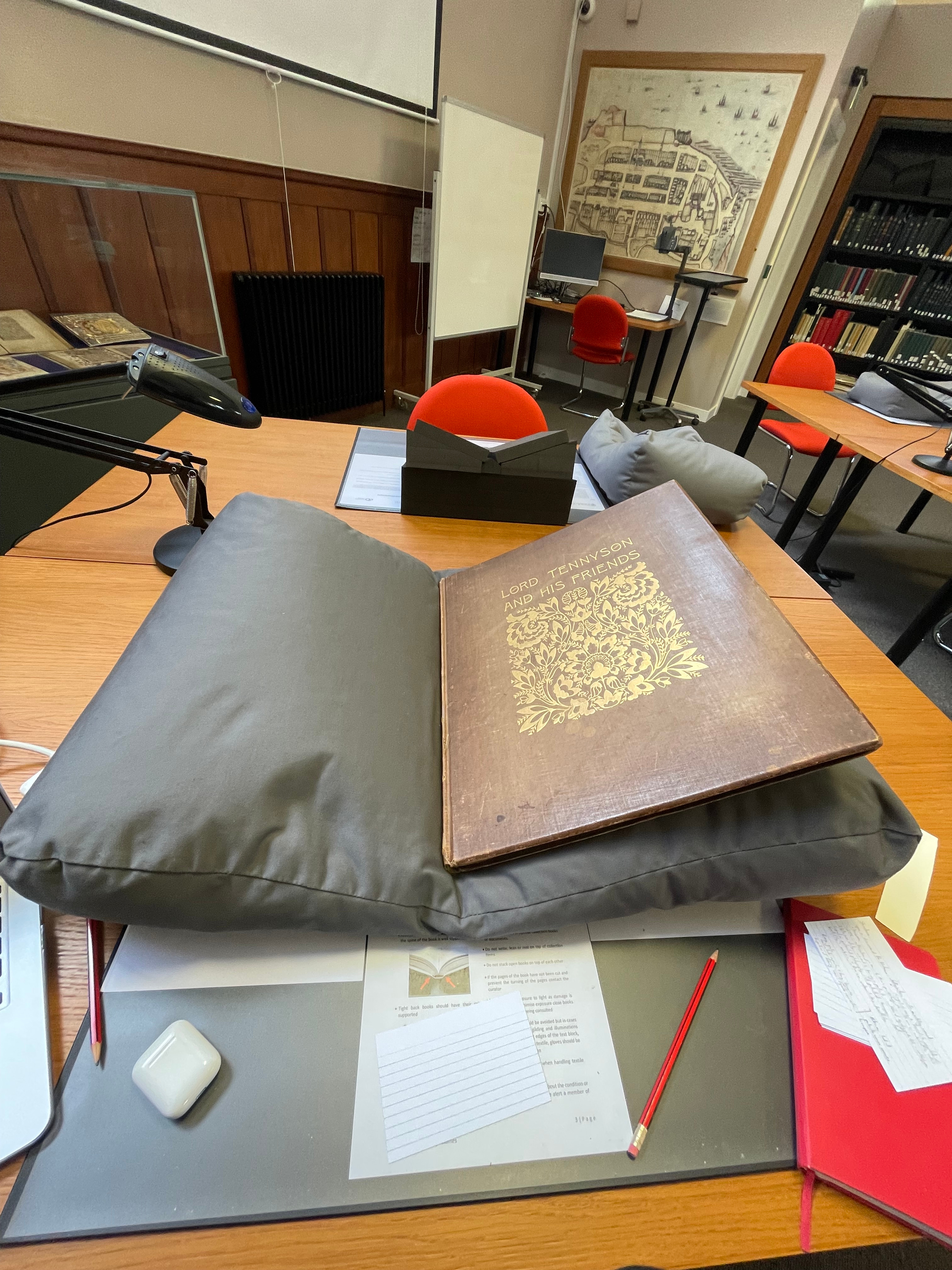 A picture of my desk in the Napier Reading Room, including an edition of Lord Tennyson and his Friends, a photomechanical book published in 1893 (University of St Andrews Libraries and Museums: Photo TR681.F3T46).