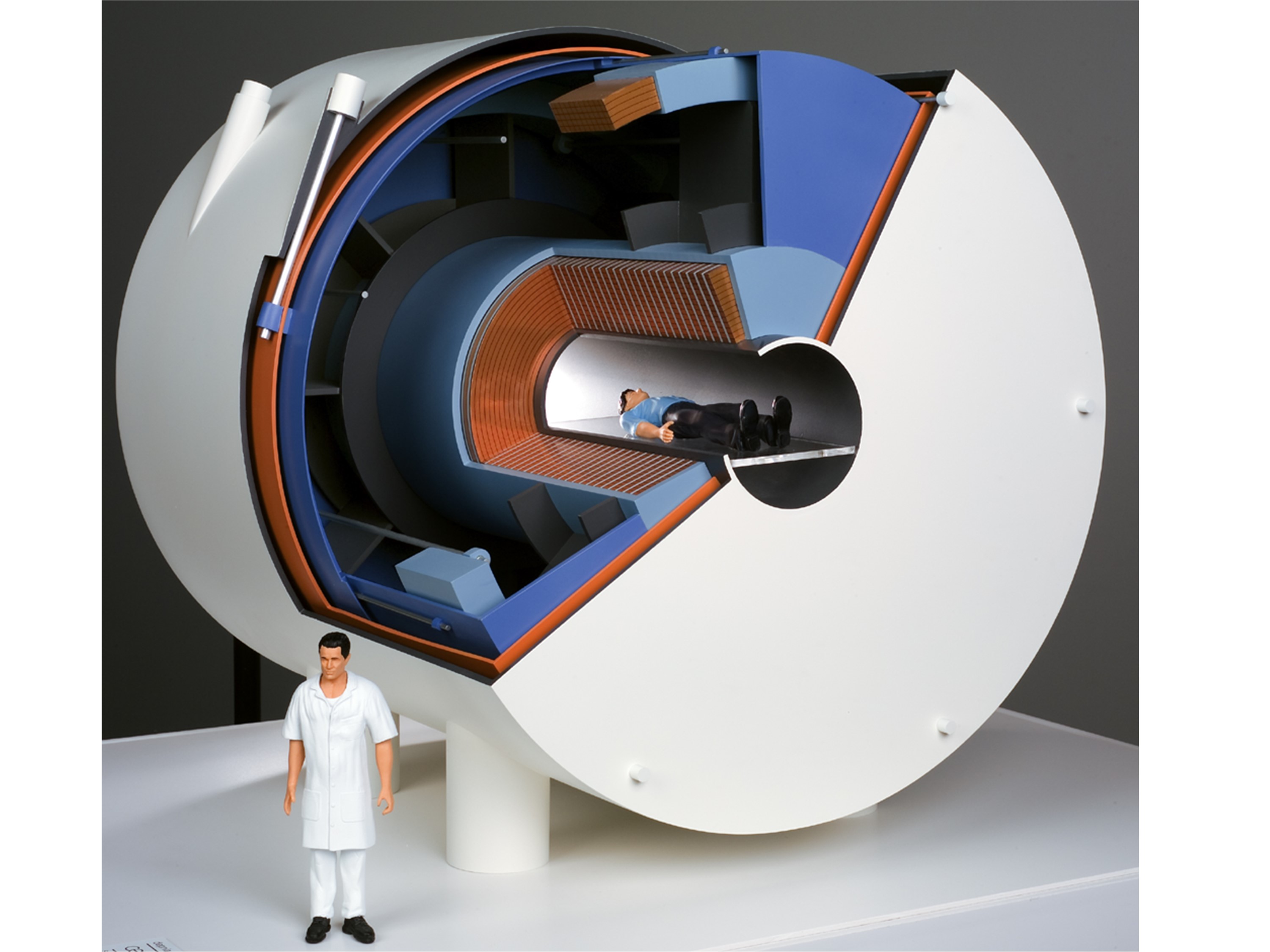 The magnet is made of a stack of 170 double pancakes immersed into a superfluid helium bath and aurreouded by exernal coils activiely shielding the magnetic field. Over all the magnet and its surrounding is around 5m in diameter and in length.