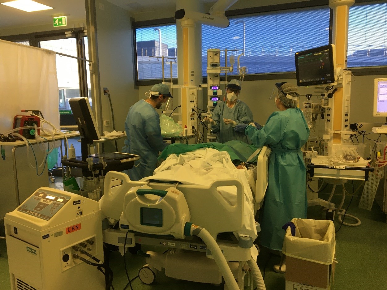 Physicians treating a patient with severe COVID-19 and acute respiratory distress syndrome in an intensive care unit at Papa Giovanni XXIII Hospital in Bergamo, northern Italy. 