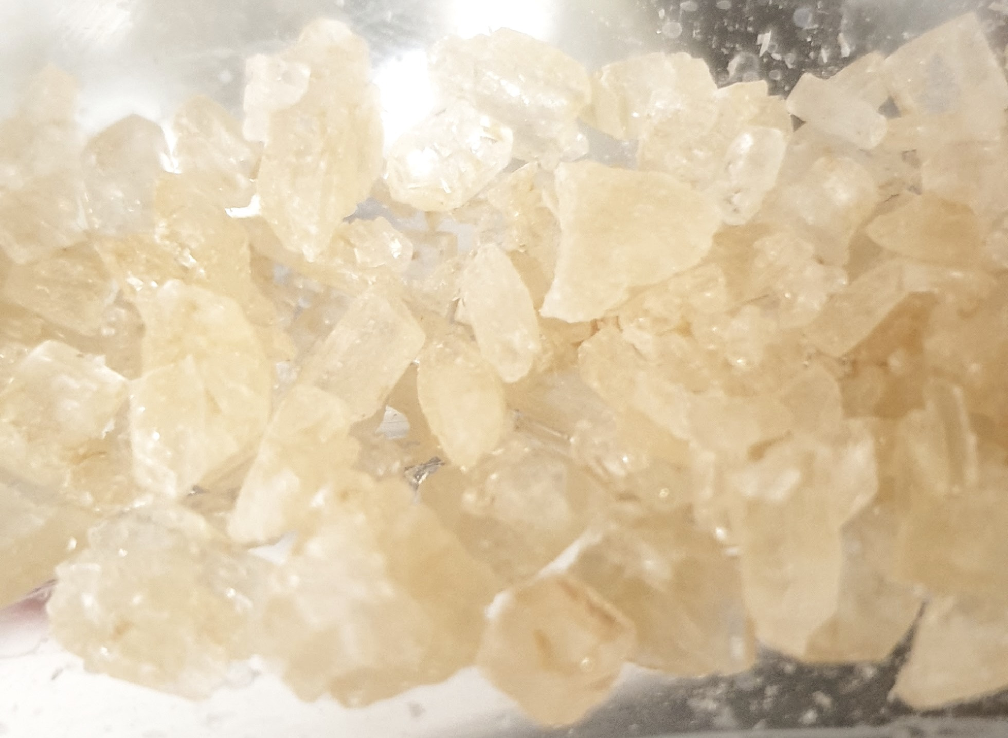 Large off-white crystals of a preparation of potassium silylamide salt