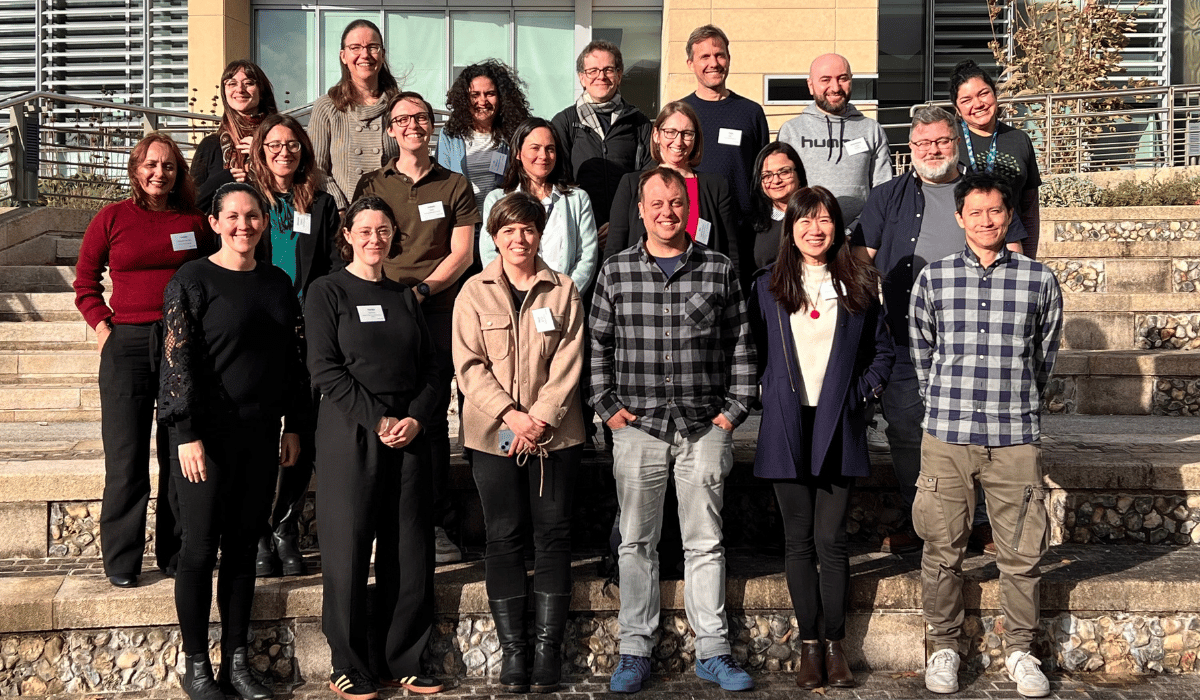 Group photo, on three levels, standing on steps.