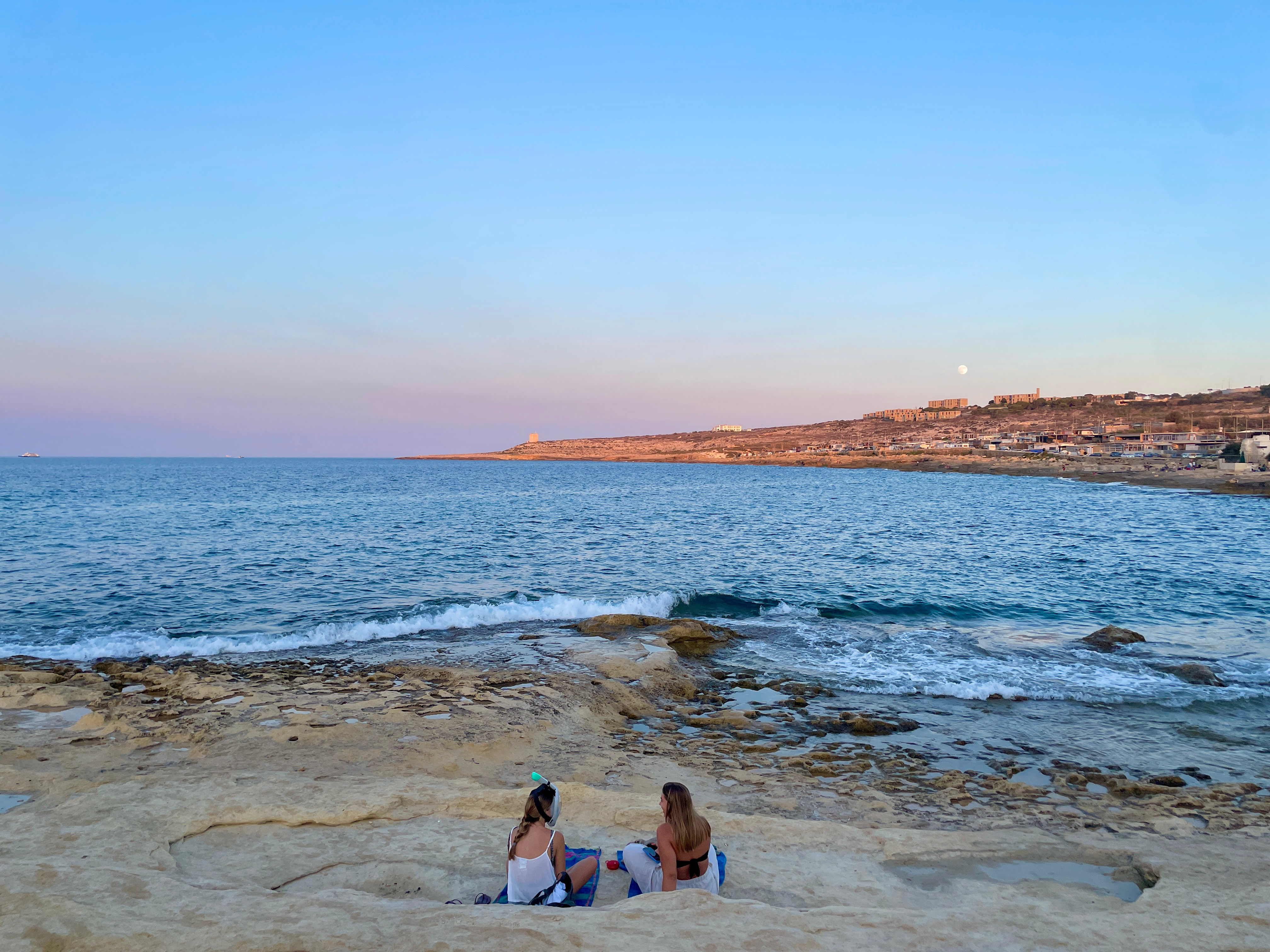 A view from Baħar iċ-Ċagħaq limestone beach looking over a bay
