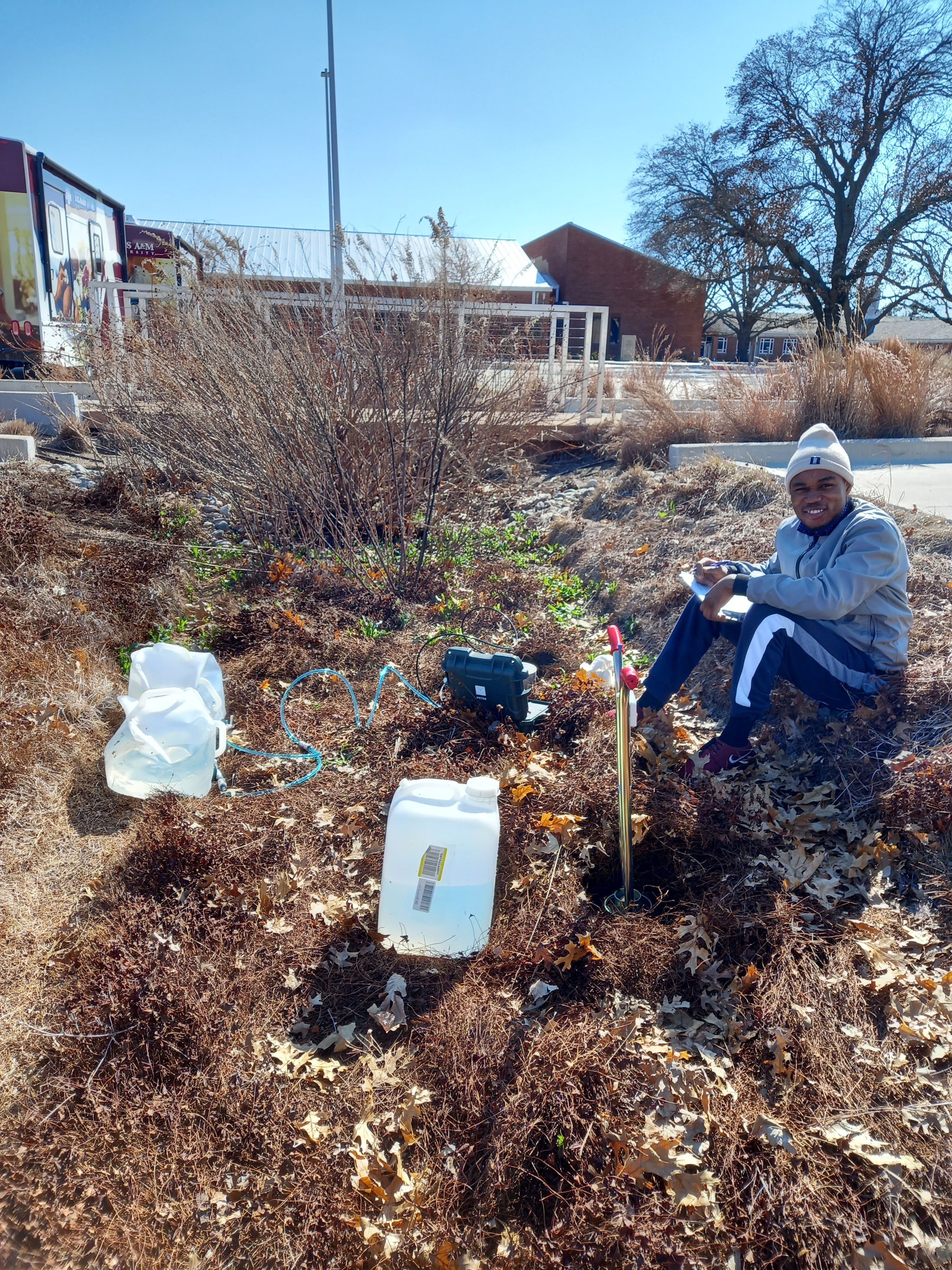 Daniel Ayejoto sampling heavy metals-contaminated soils and water.