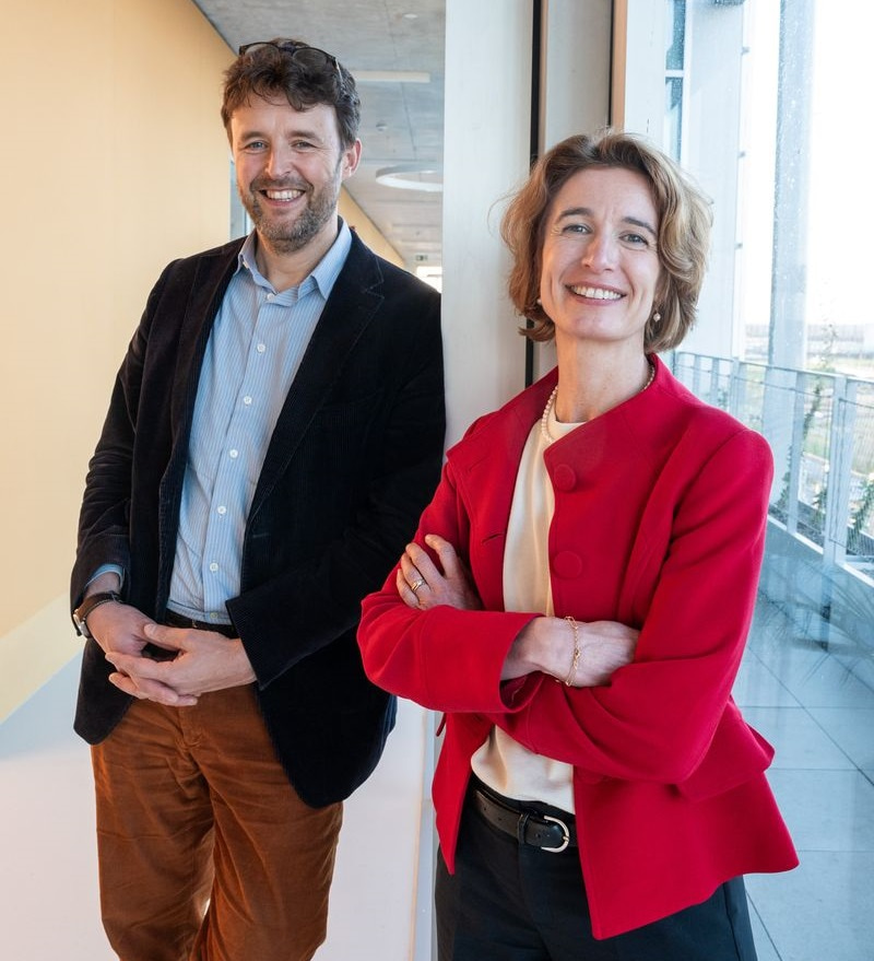 Photo of Jérôme Van Biervliet, on the left, and Christine Durinx, facing the camera and smiling.