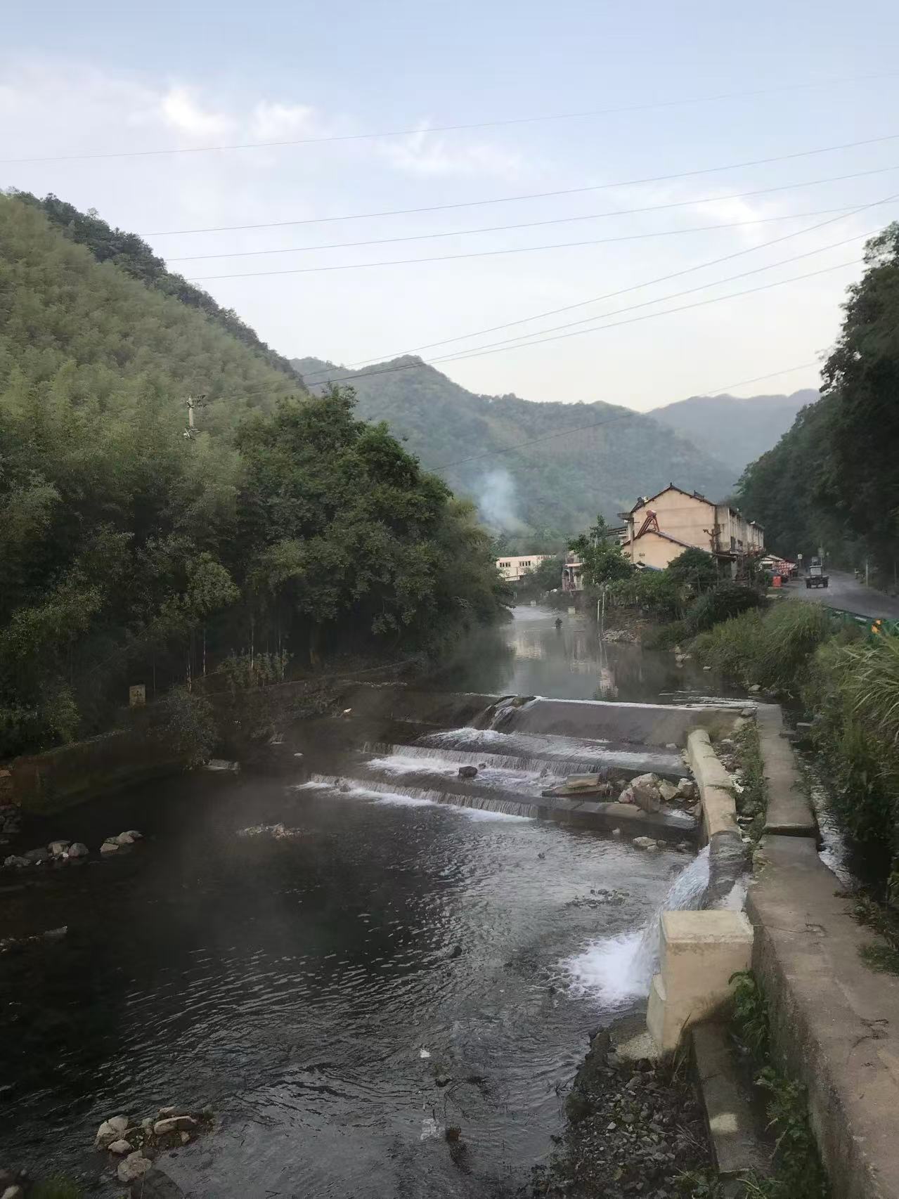 Rural residents cook and smoke rises