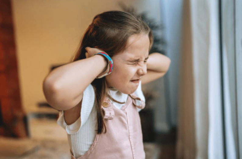 girl covering ears Getty Images
