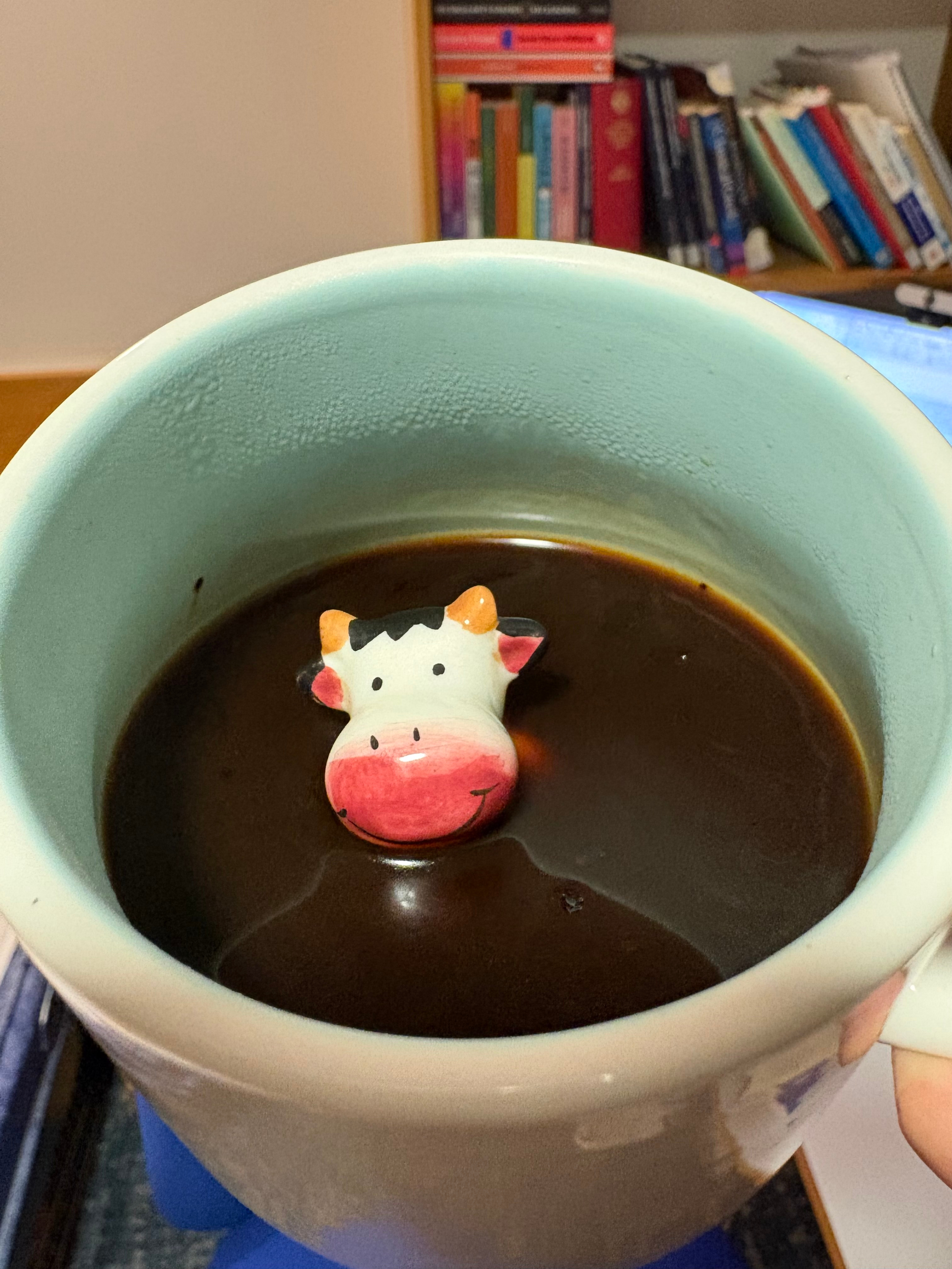 A Coffee Mug with a Porcelain cow