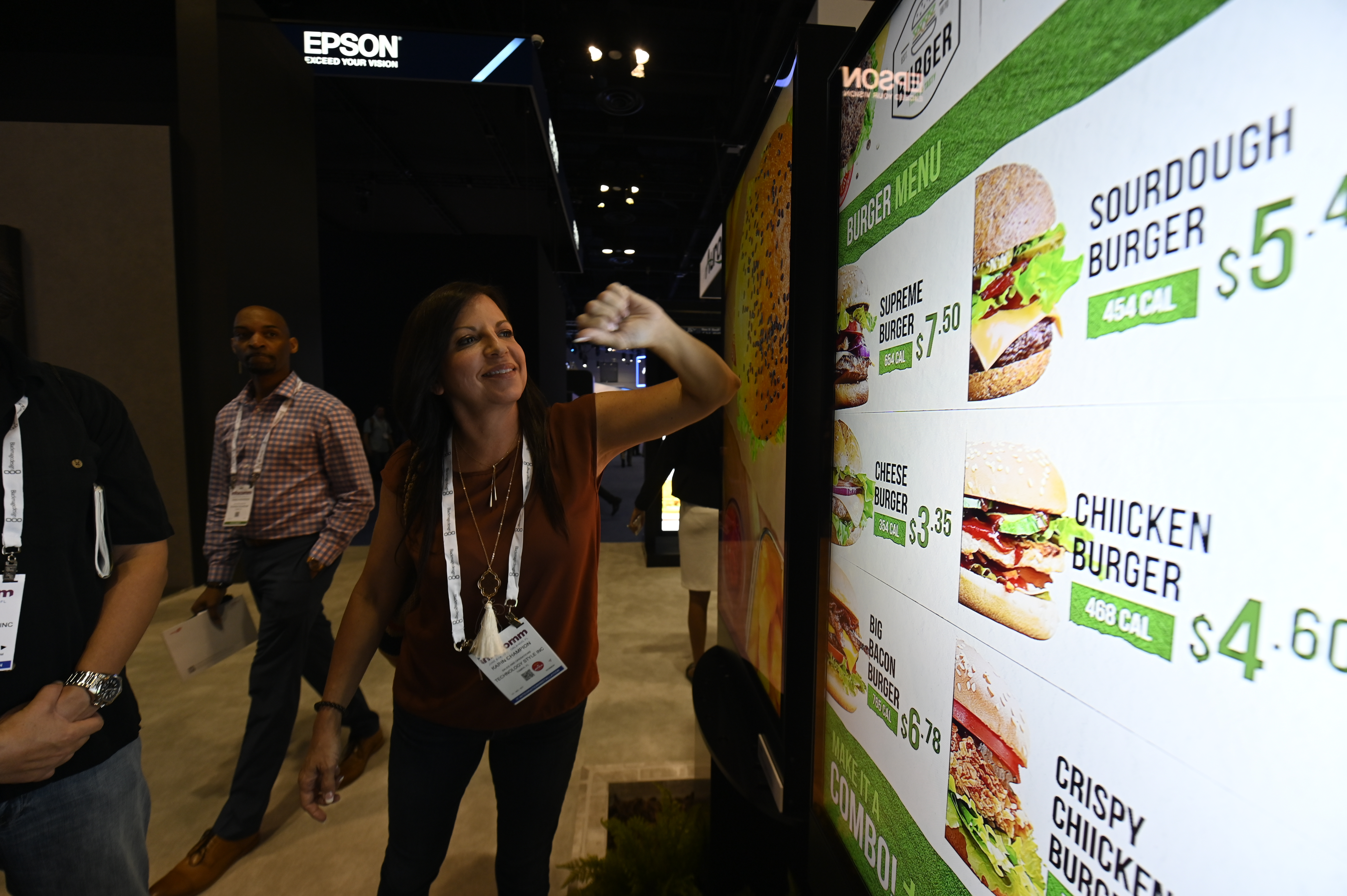 Woman demonstrating a digital menu board
