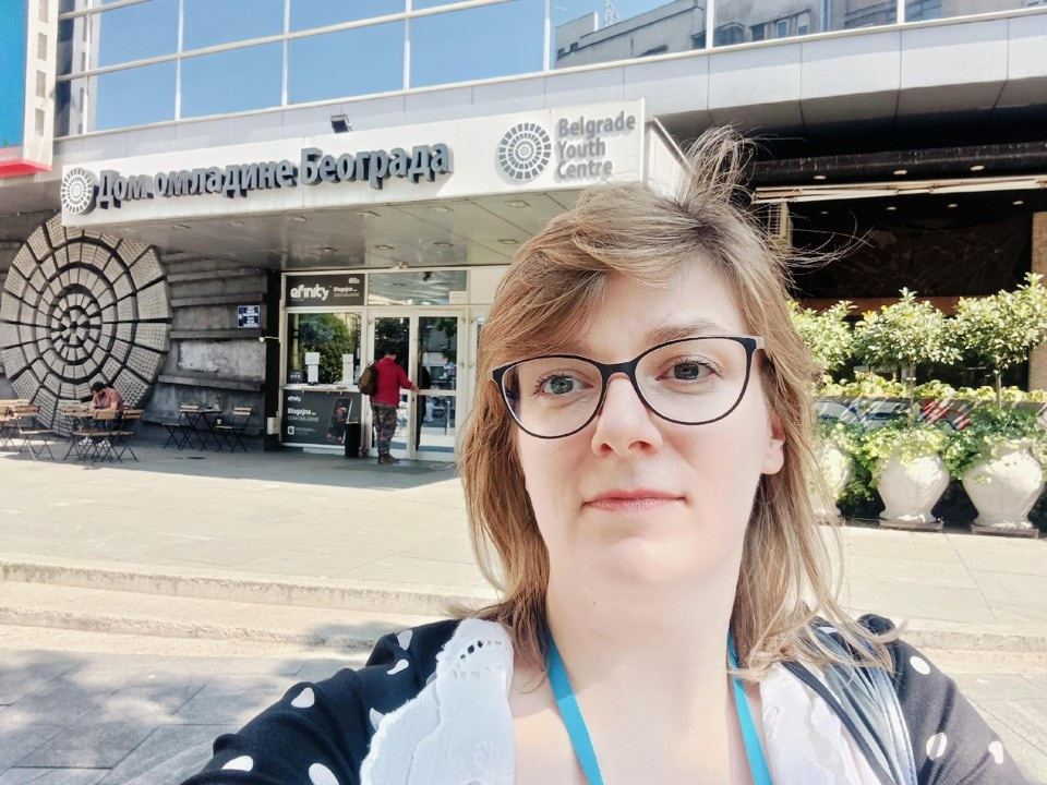 Close up of Beata Siemiątkowska with venue in the background.