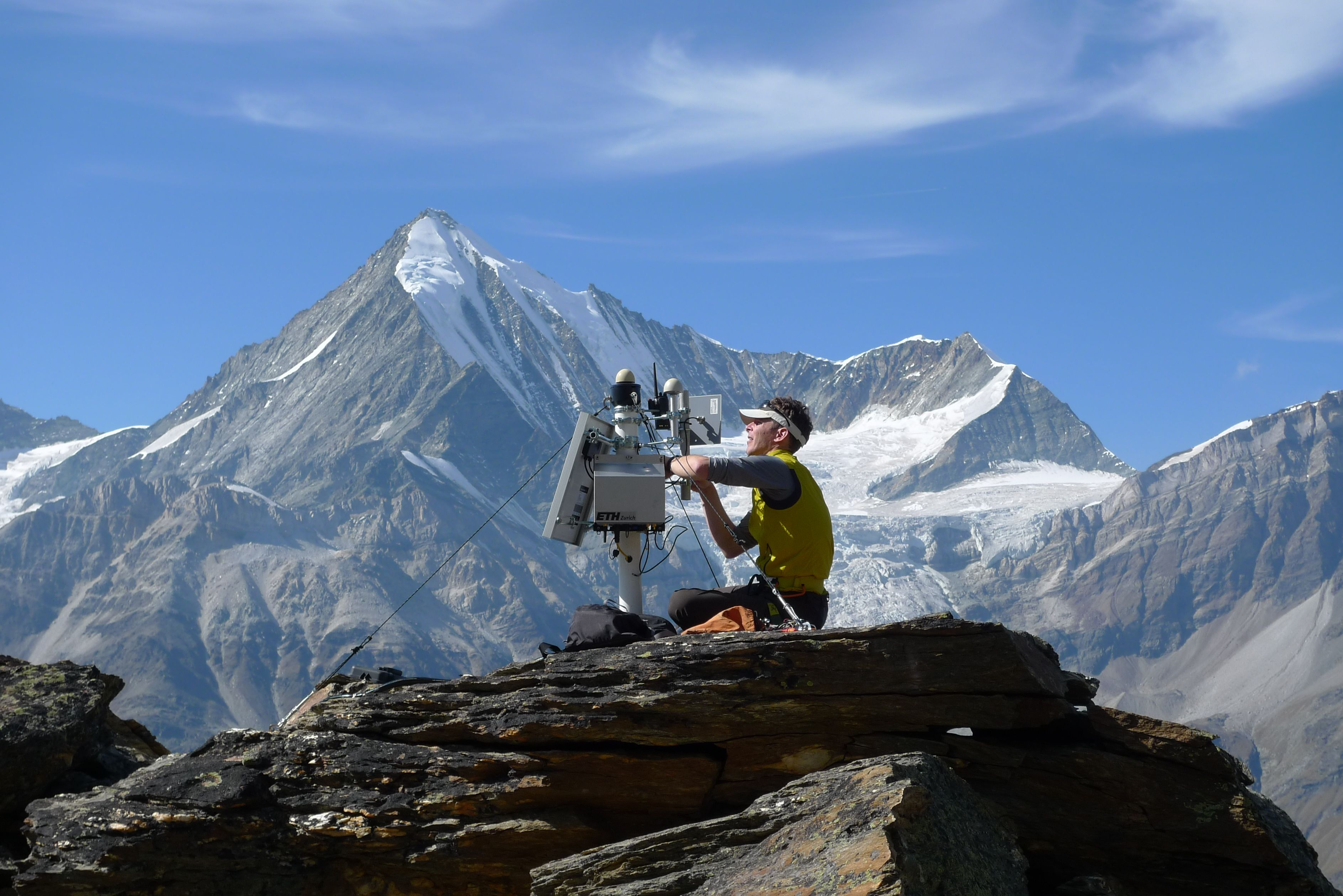 Jan maintaining a sensor at the Grabengufer landslide. Foto: PermaSense project.