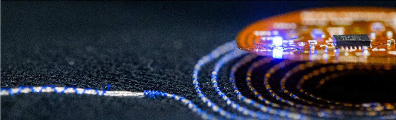 Clothing provide near-field connectivity for skin-like sensors