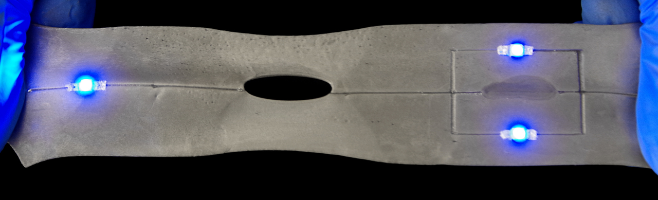 Liquid metal composites for damage tolerant and recyclable soft electronics