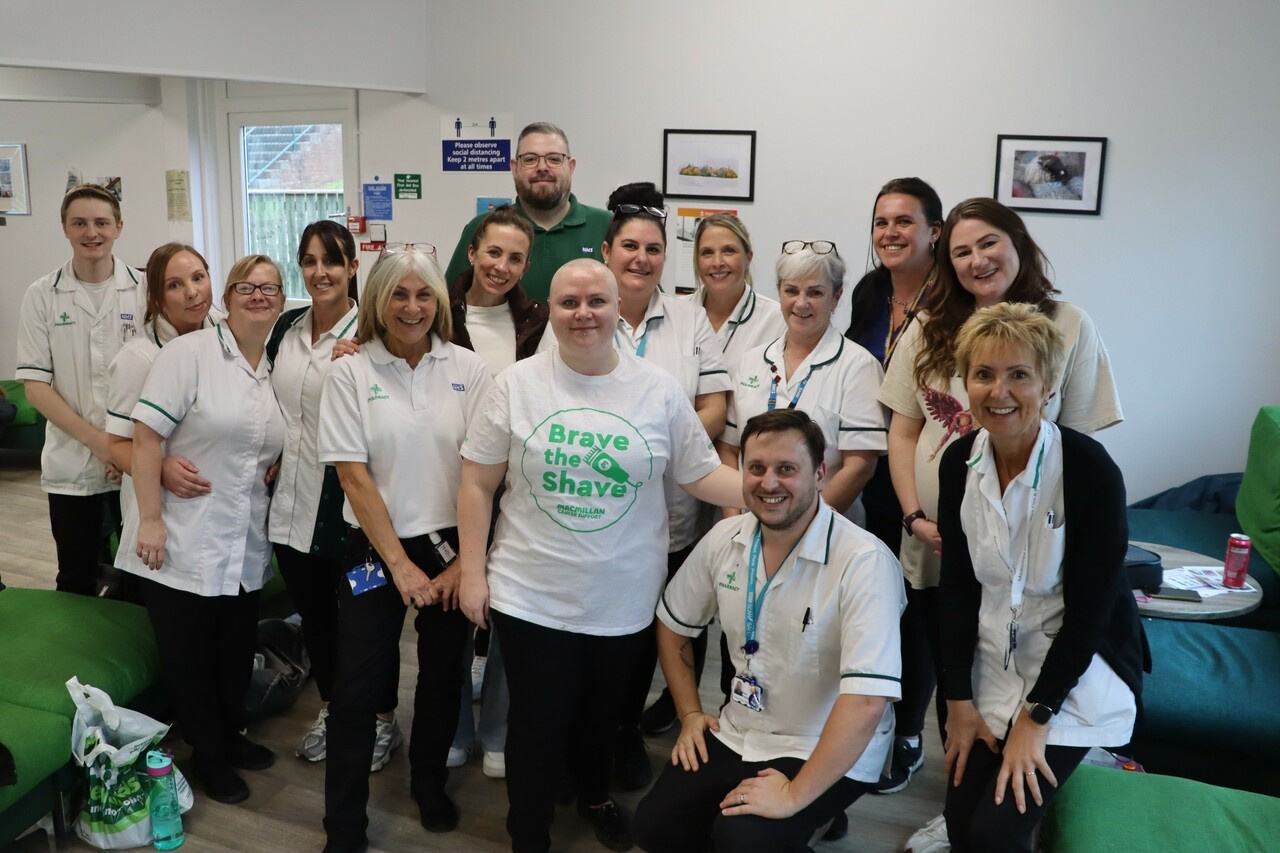 Pharmacy technician shaves blue hair for cancer