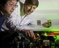 Ronald Walsworth (r) and Chih-Hao Li (l) adjust a laser frequency comb used in the search for Earth-like exoplanets. Photo credit: Harvard-Smithsonian Center for Astrophysics 