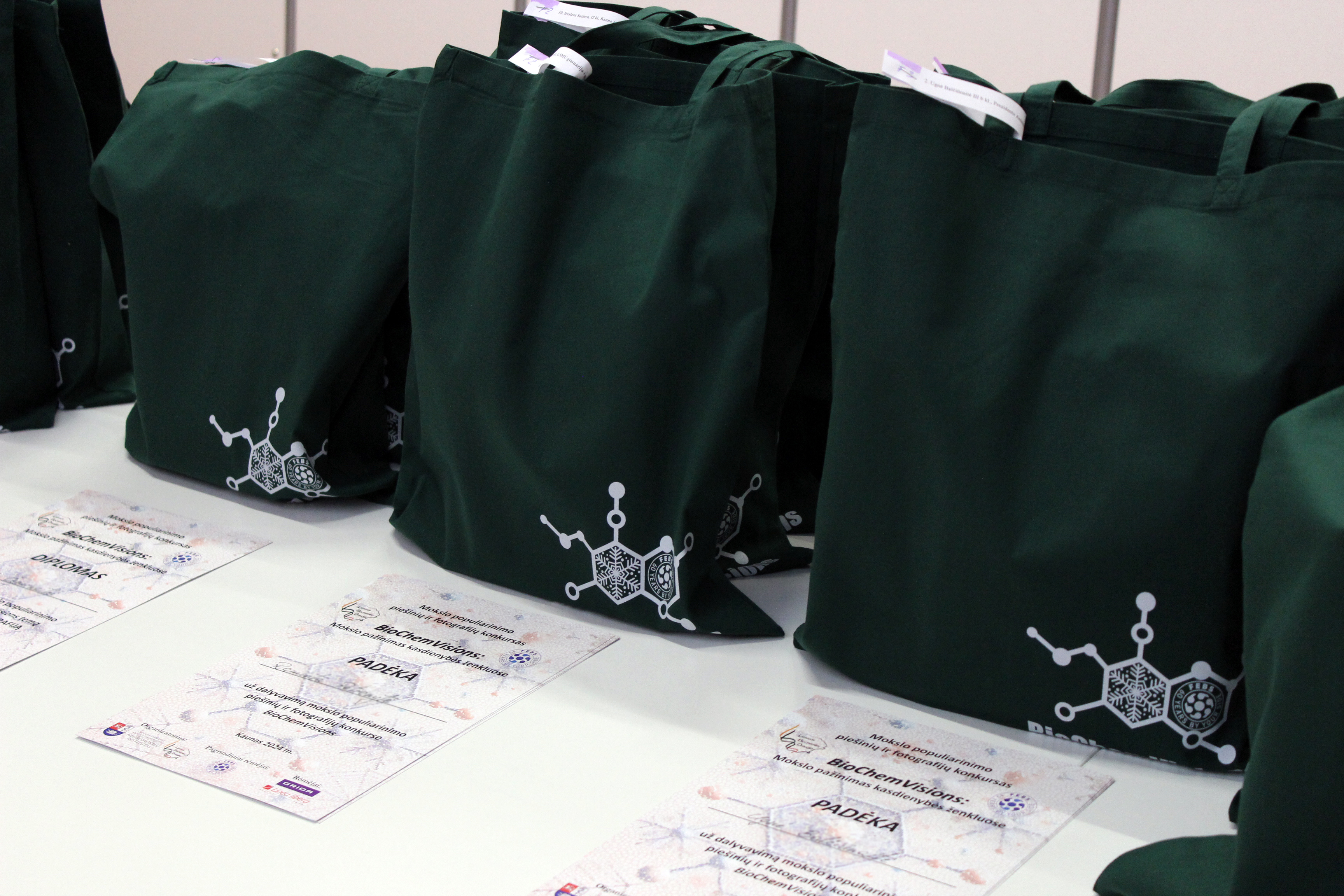 Photo showing certificates and gifts on a table.