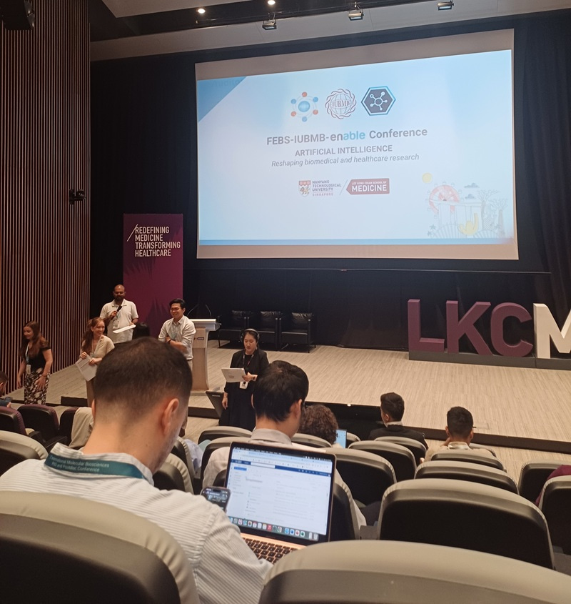 Photo of the conference stage taken from the seats.