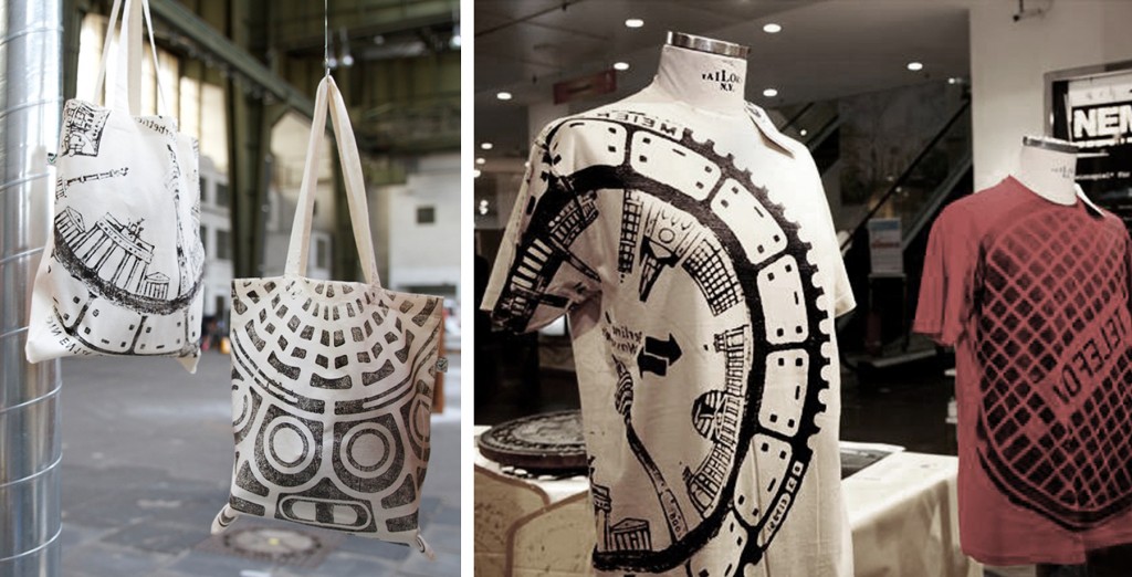 A picture of the finished printed clothes and bags in a display cabinet.