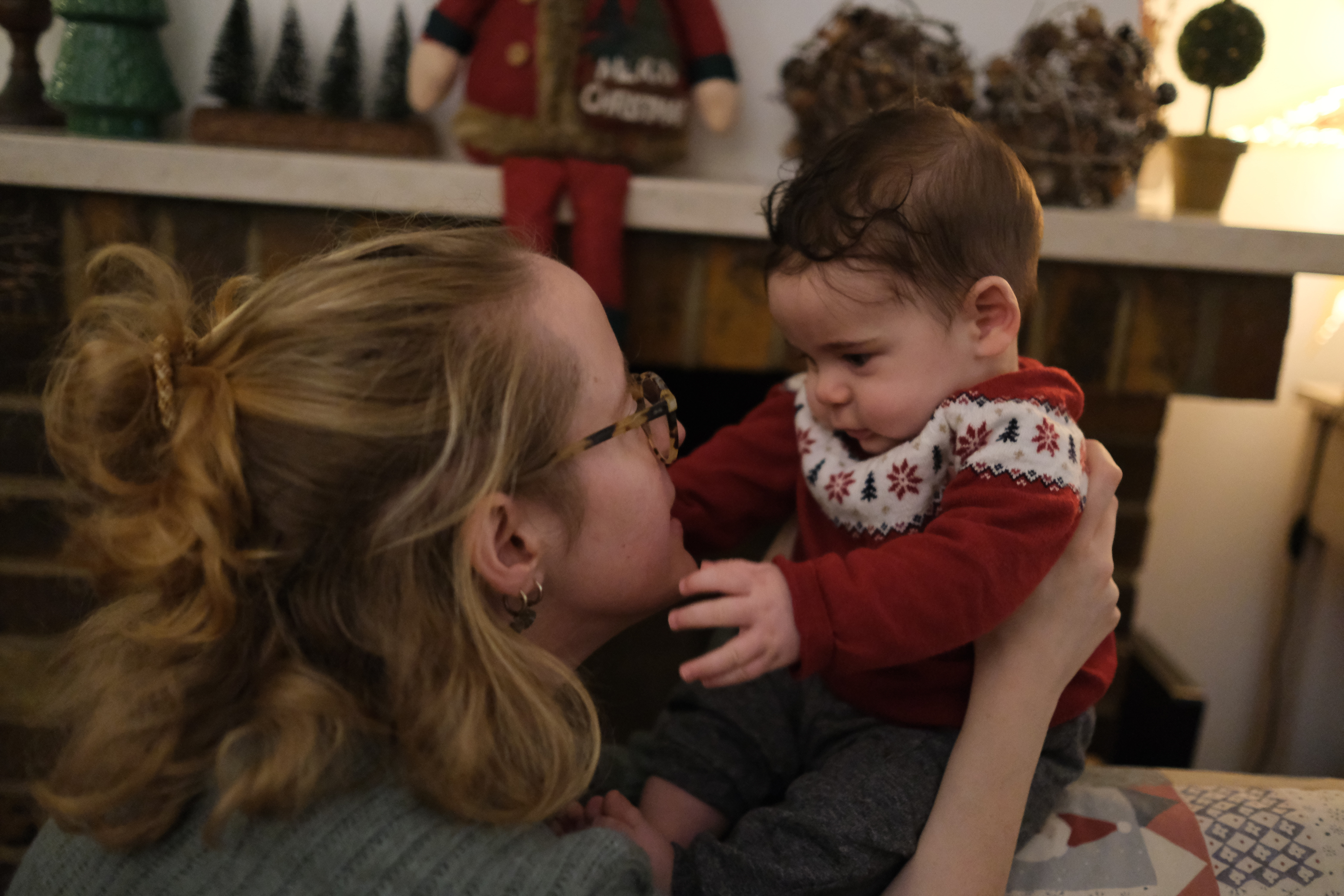 A 5-month-old baby looking at their mother’s face. 