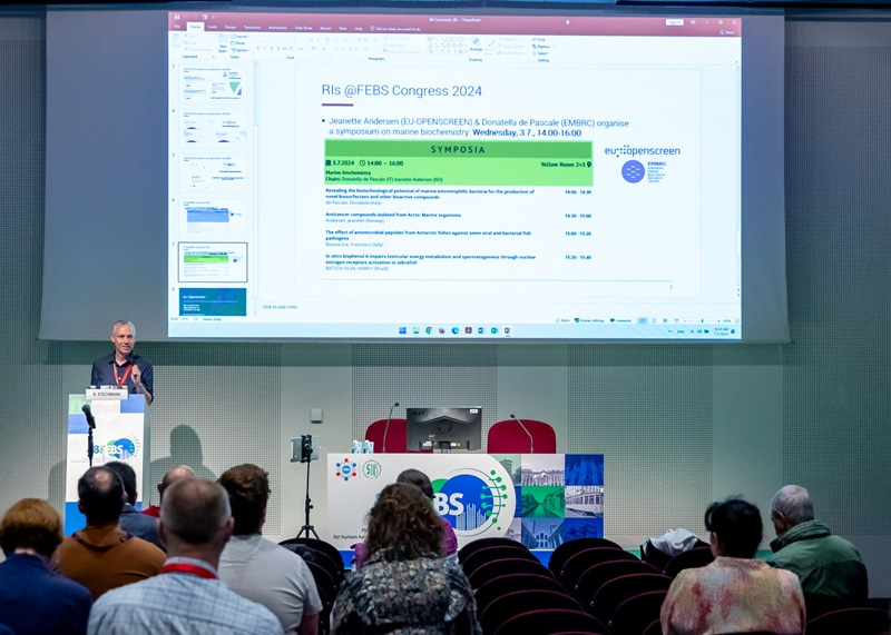 Photo of Bahne Stechmann, from EU-OPENSCREEN, giving a talk in front of projected slides.