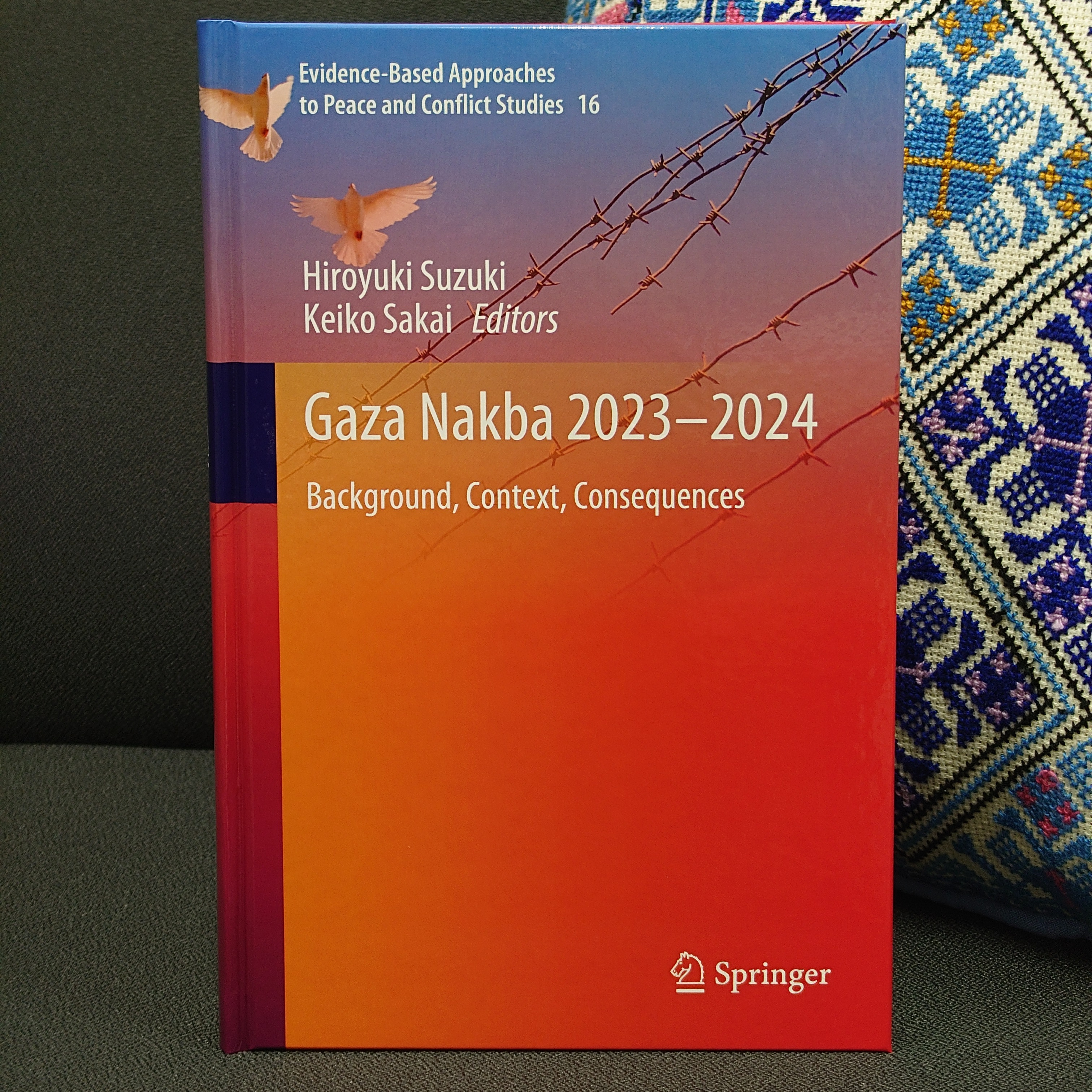 Gaza Nakba 2023-2024 Photo of book with Palestine Tatreez style cushion