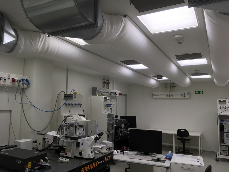 Photo of a room of the light microscope facility with large textile-based ductwork from the air conditioning system.