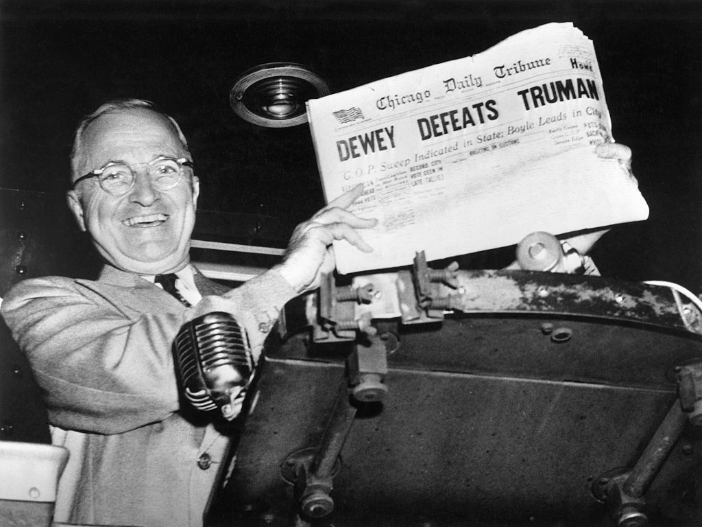 President Truman holding Newspaper that reads "Dewey Defeats Truman"