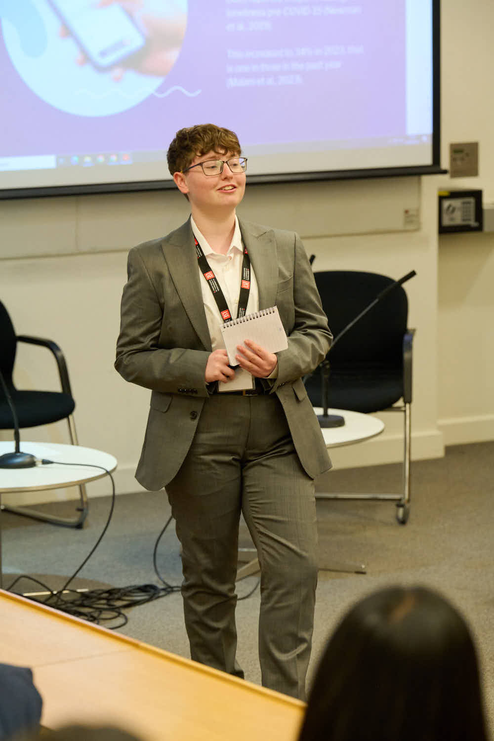 Myself, Sebastian, mid-presentation at BCUR, I am stood in a small lecture room.