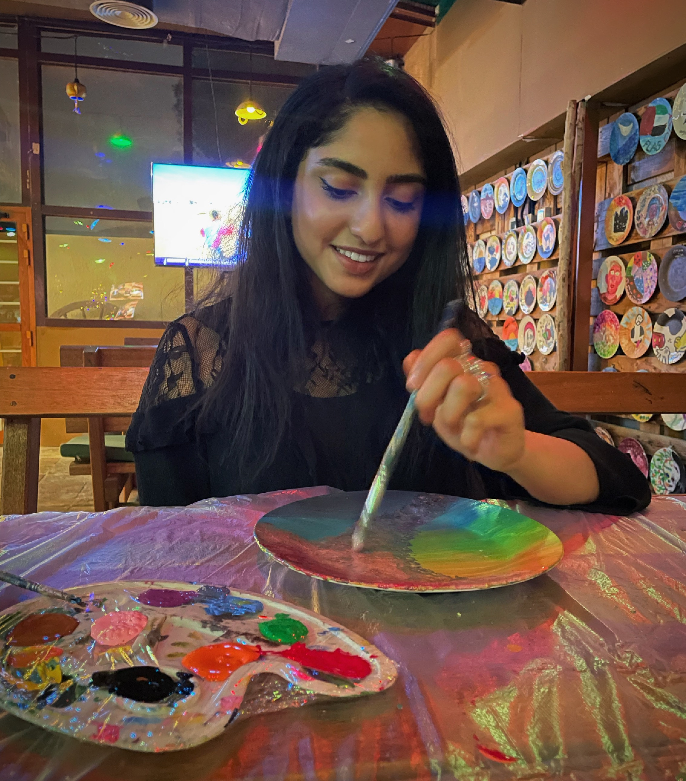 Being with my family for the holidays has been a blessing. My mum and I had a little mother-daughter date. This is a picture she took of me painting a plate! 