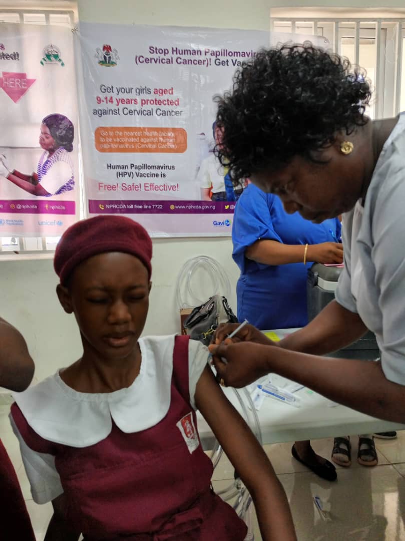Vaccination of a school girl during the campaign