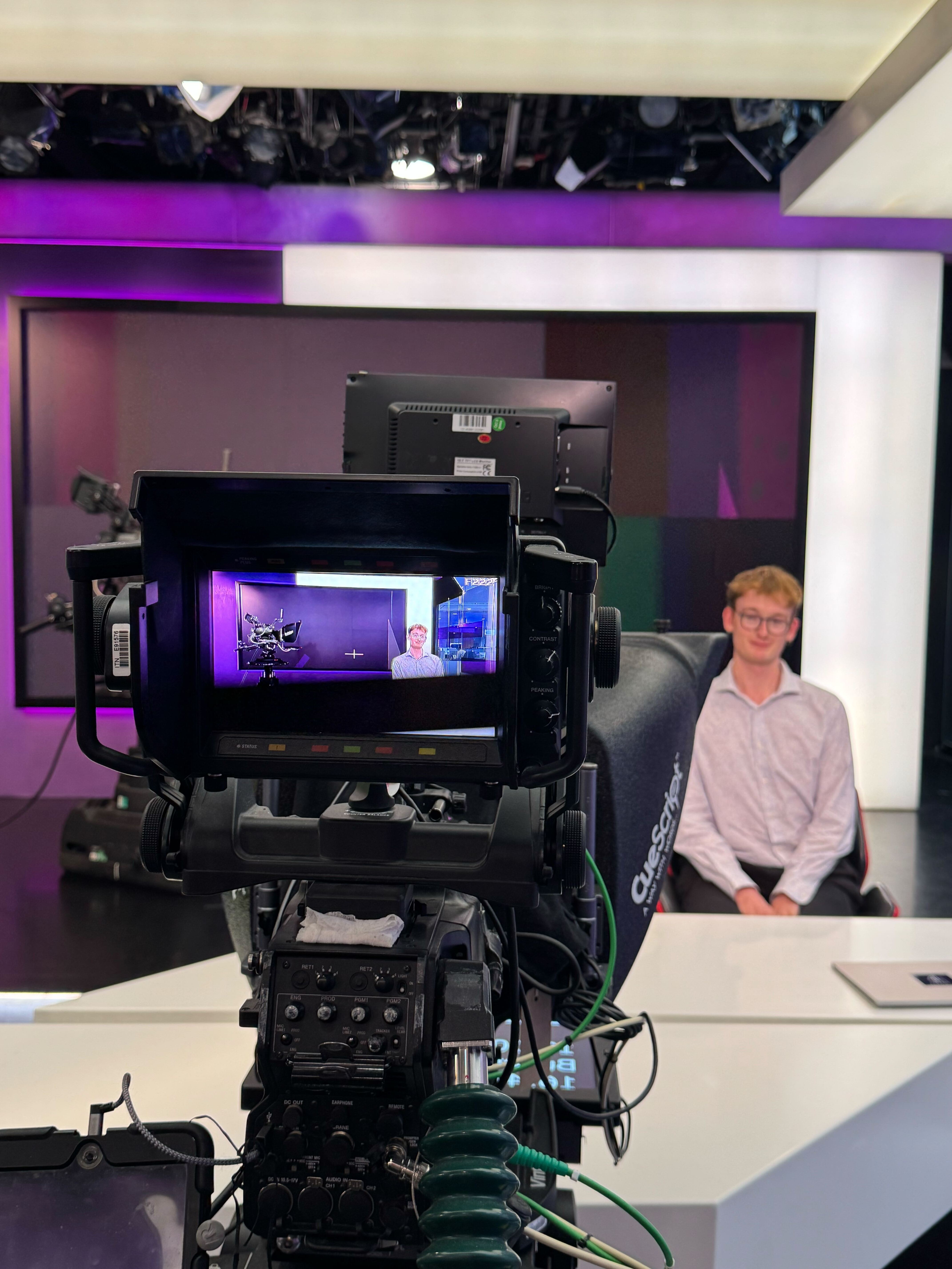 ITN HQ visit. Me sat in the news readers chair at Channel 4 News.