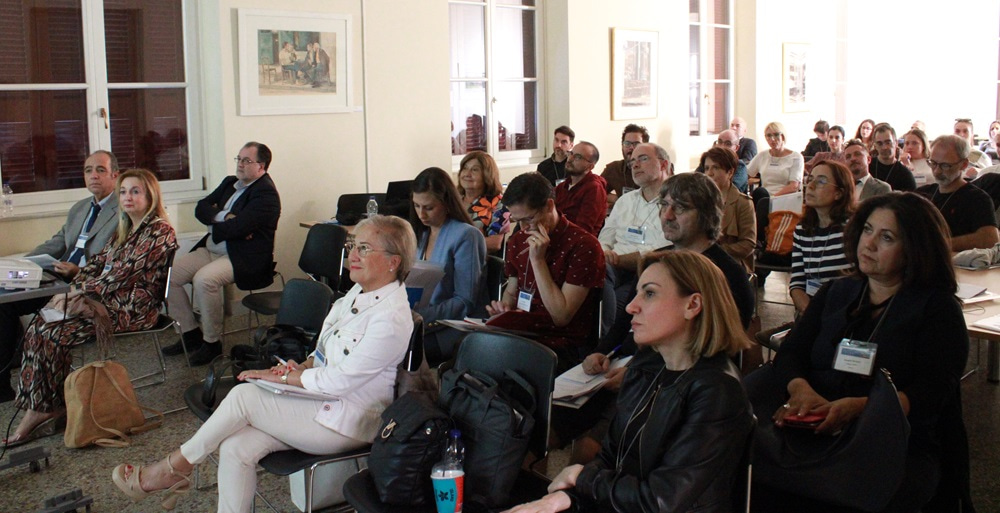 Photo of attendees at the event, listening to the speaker.