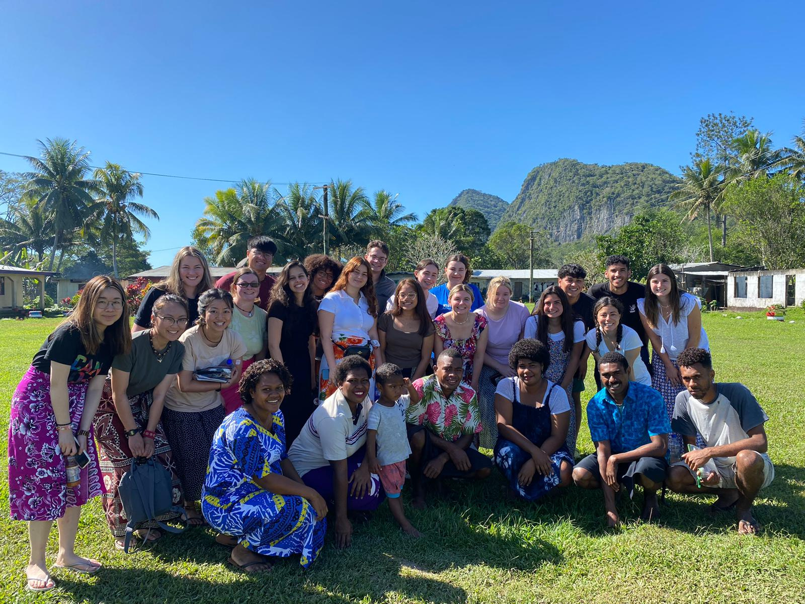 The team of volunteers I worked with in Fiji, and some of the village youth, gathered together on the village green.