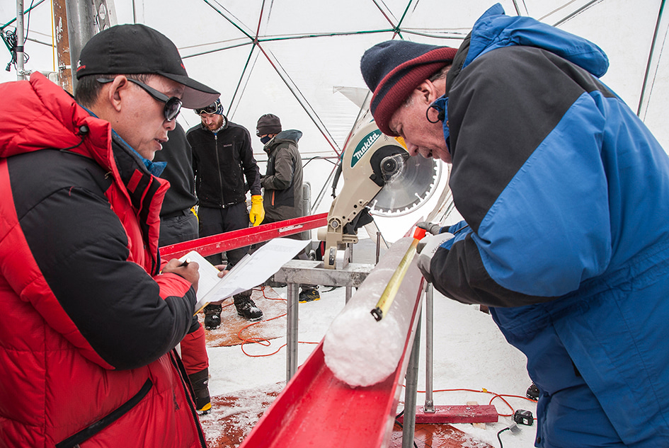 Lonnie G. Thompson (right) and Tandong Yao (left) measuring the Guliya ice core section. Photo: Jane Qui