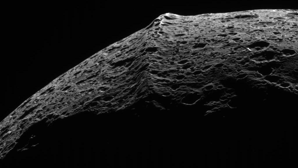 The equatorial ridge of Iapetus, a moon of Saturn. The equatorial ridge of Iapetus, a moon of Saturn.