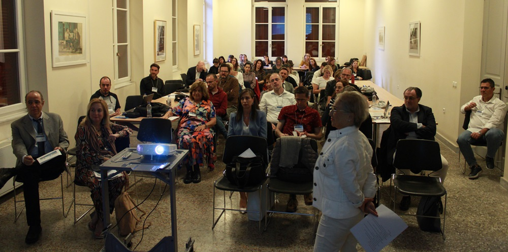 Photo of attendees at the event, listening to the speaker.