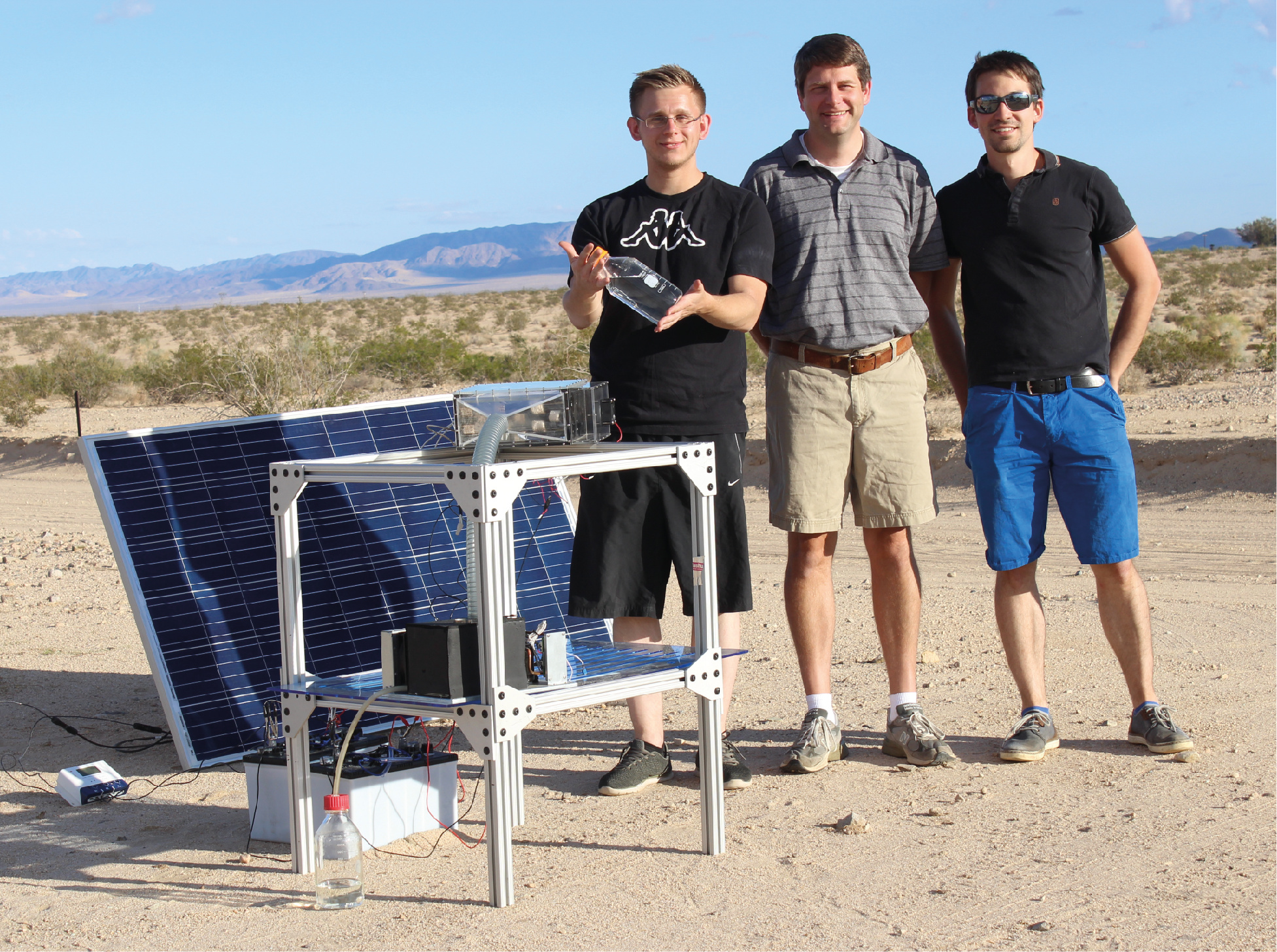 Figure 1: Water harvesting team along with the latest atmospheric, solar-driven MOF-based water harvester. Figure 1: Water harvesting team along with the latest atmospheric, solar-driven MOF-based water harvester.