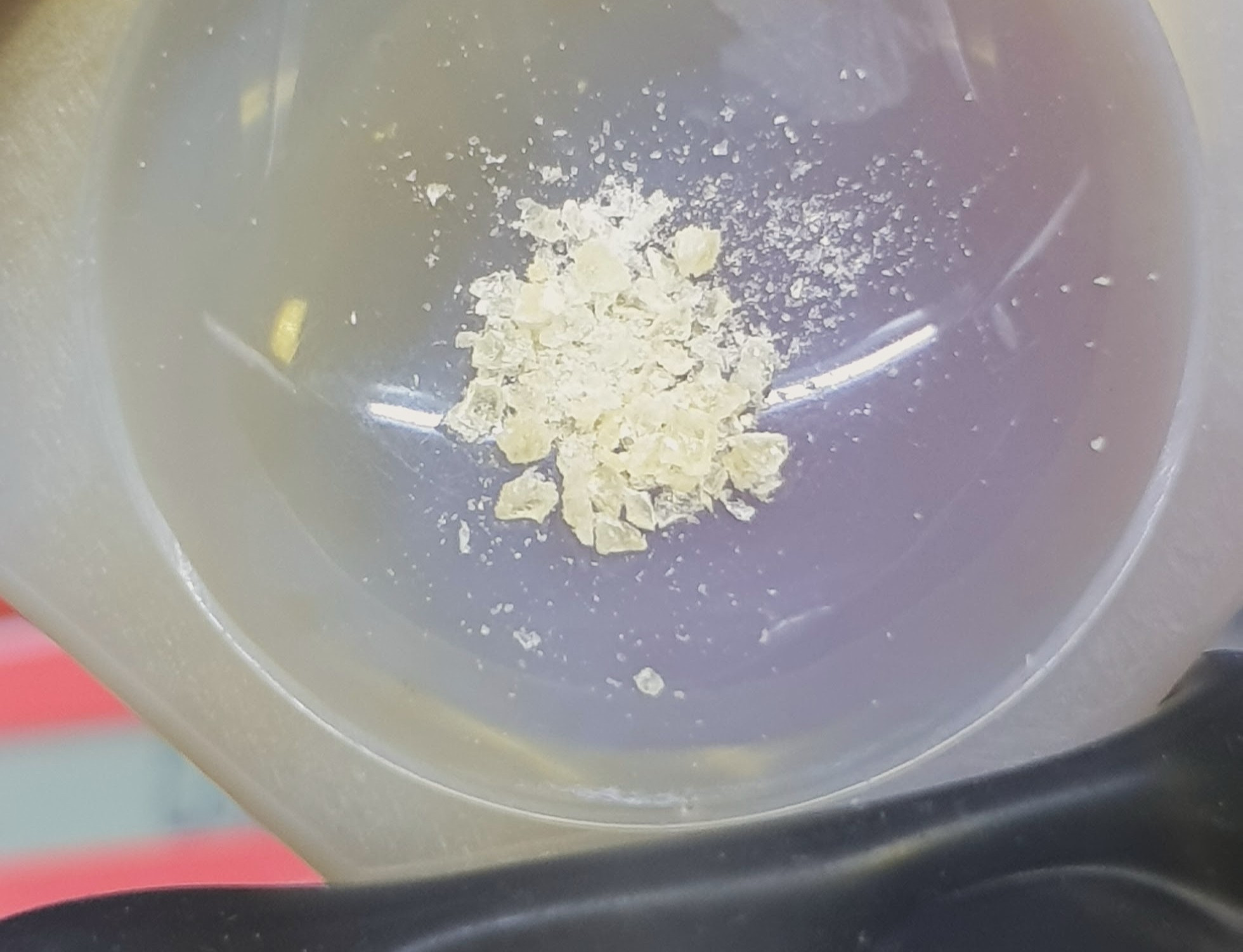 A mortar containing crystals of a dysprosium silylamide complex