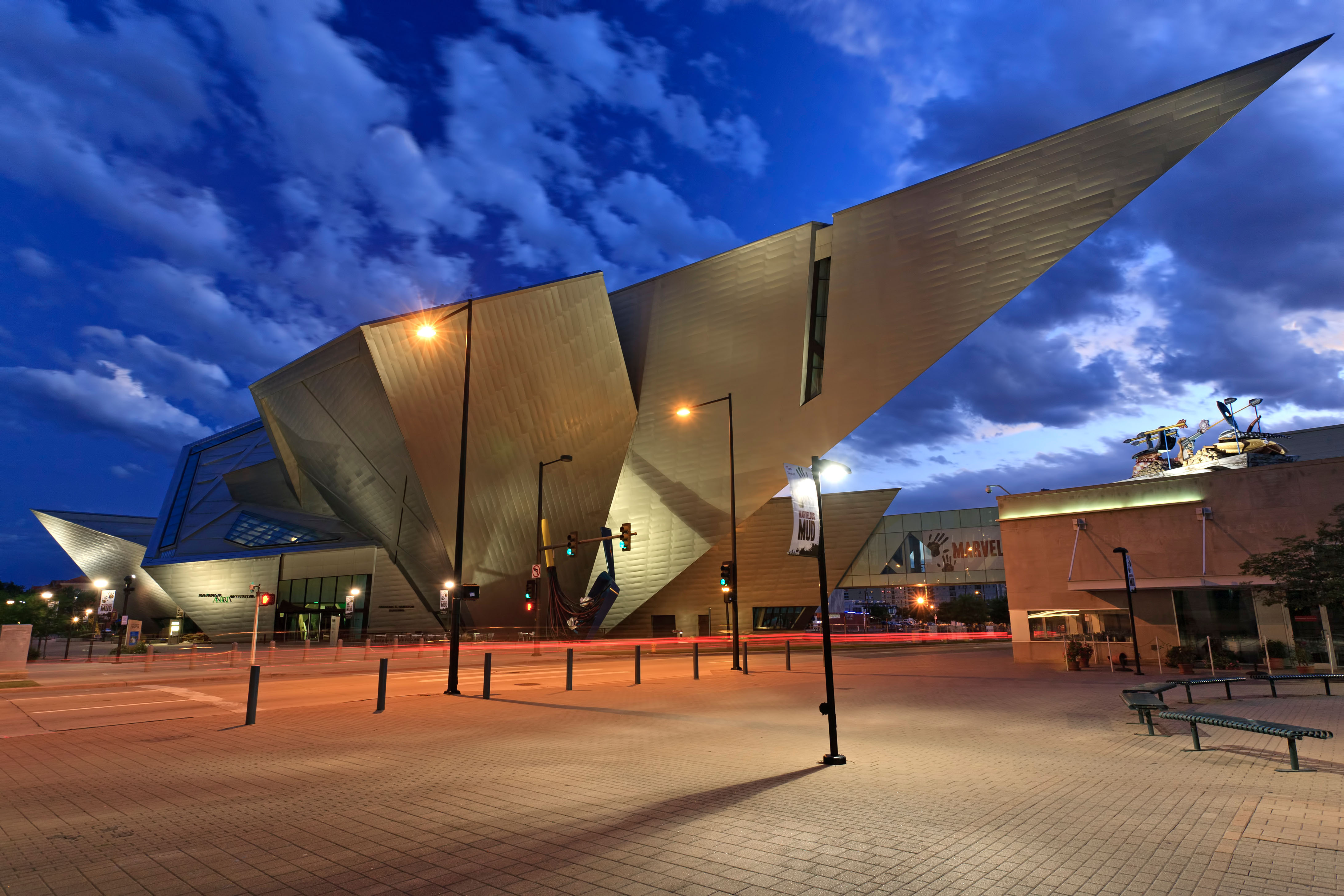 A photo of the Denver Art Museum against the backdrop of the night sky.