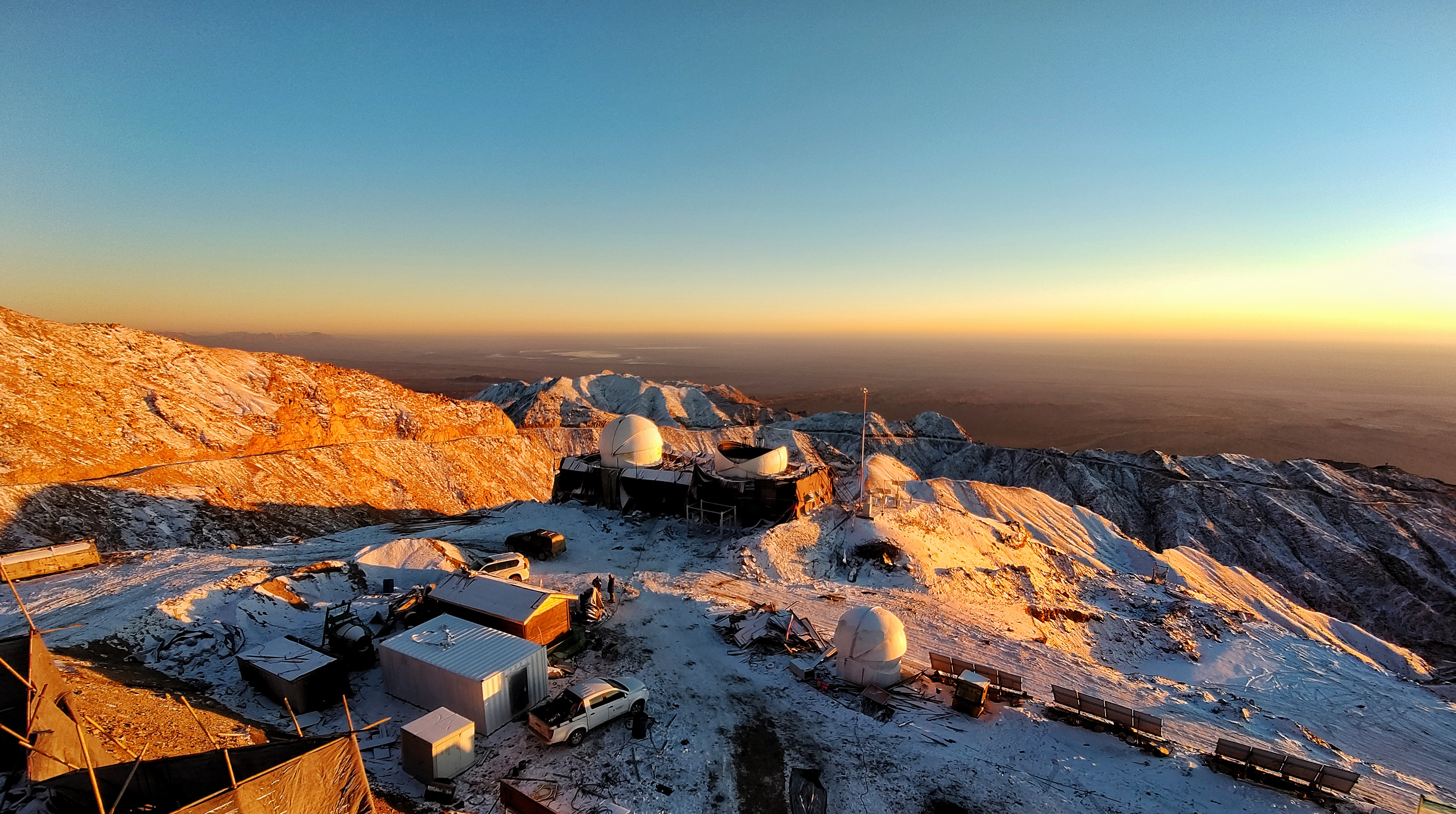 The Lenghu observing site at dawn. Showing in the center are two small telescopes, more facilities are coming including a 6.5m Magellen type telescope for spectral survey.