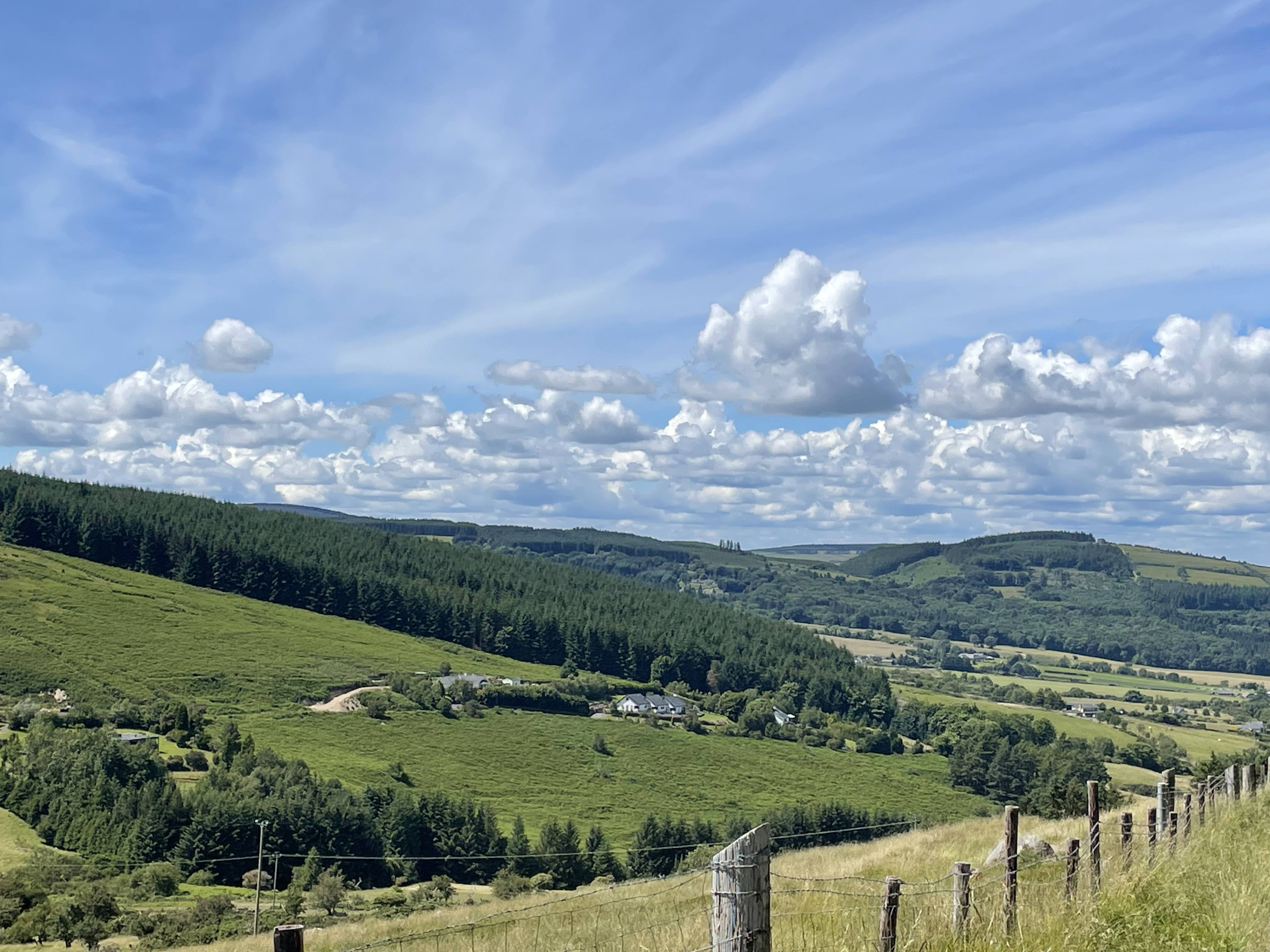 A rolling landscape, including pastures and grasslands